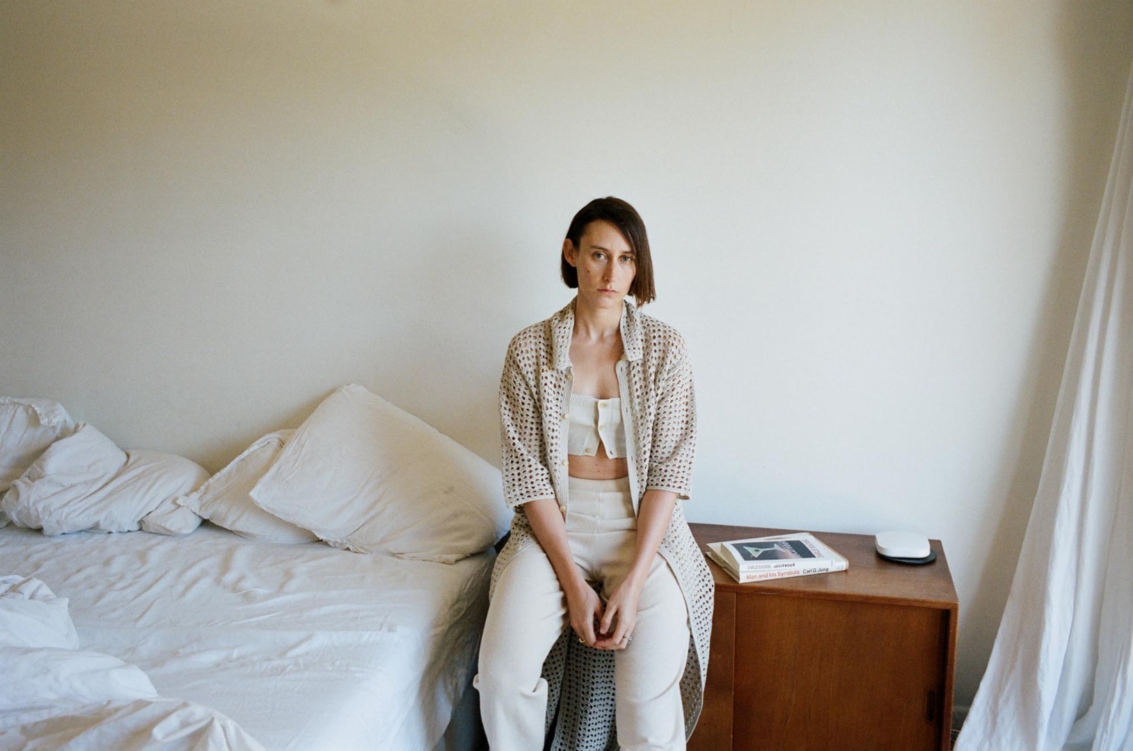 Clara wears Hand Crochet Cotton Knit One-Piece, Dry Cotton Knit Bandeau, High Gauge Cotton Pile Knit Pants in Ivory