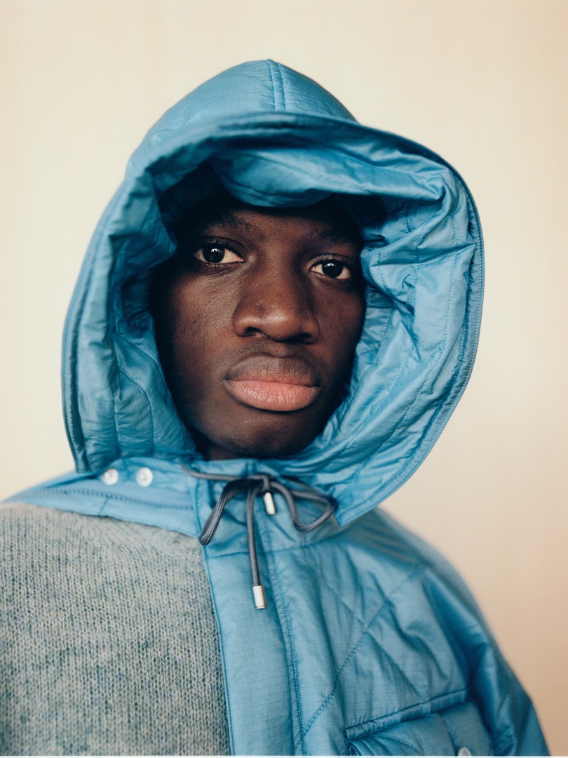 Mamadou wears Quilted Super Light Nylon Ripstop Field Blouson in Blue