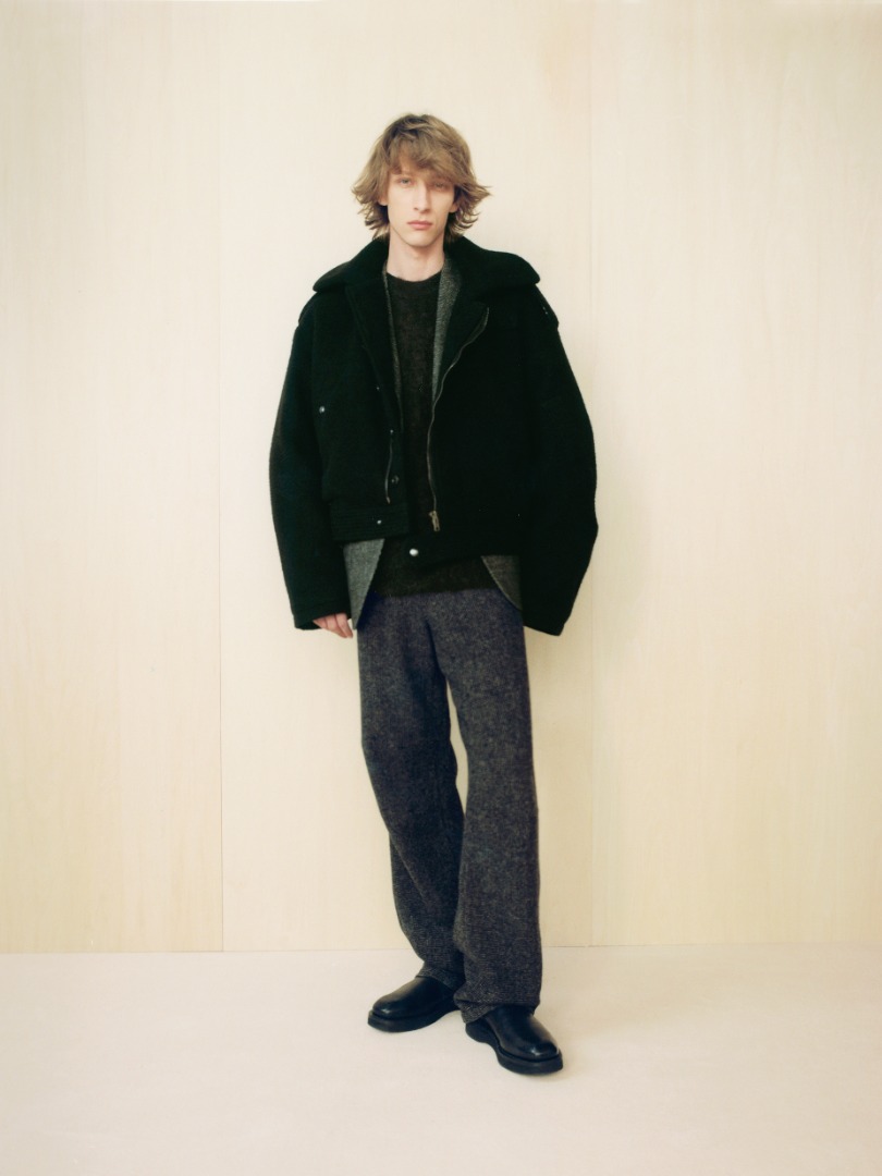 Josef wears Brushed Baby Camel Melton Blouson in Black, Wool Hairline Light Tweed Over Pants in Top Charcoal