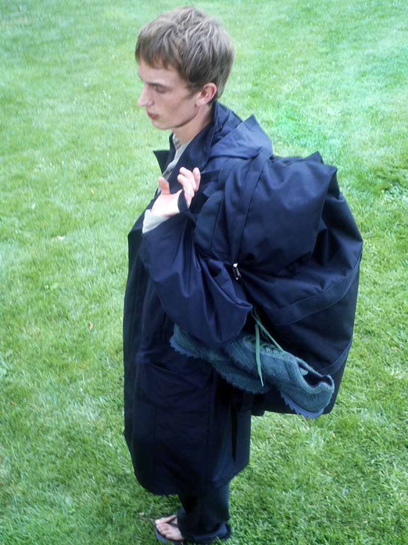 Maurits wears High Density Cotton Polyester Cloth Hooded Coat in Black