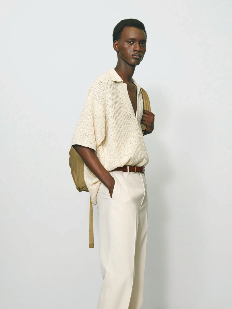 Bangali wears Brushed Cotton Wool Rib Knit Skipper Polo in Ecru, Light Wool Max Gabardine Slacks in Ivory White