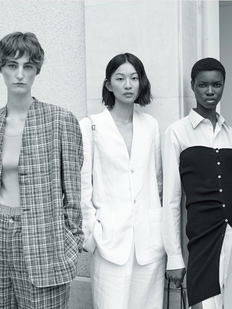 Ines wears Linen Silk Check No Collar Jacket in Brown Check. Hsiang wears Linen Gabardine No Collar jacket in Ivory White. Elvina wears Finx Polyester Stripe Shirt One-Piece in Light Blue Stripe, Super Fine Cashmere Silk Knit Long Camisole in Black