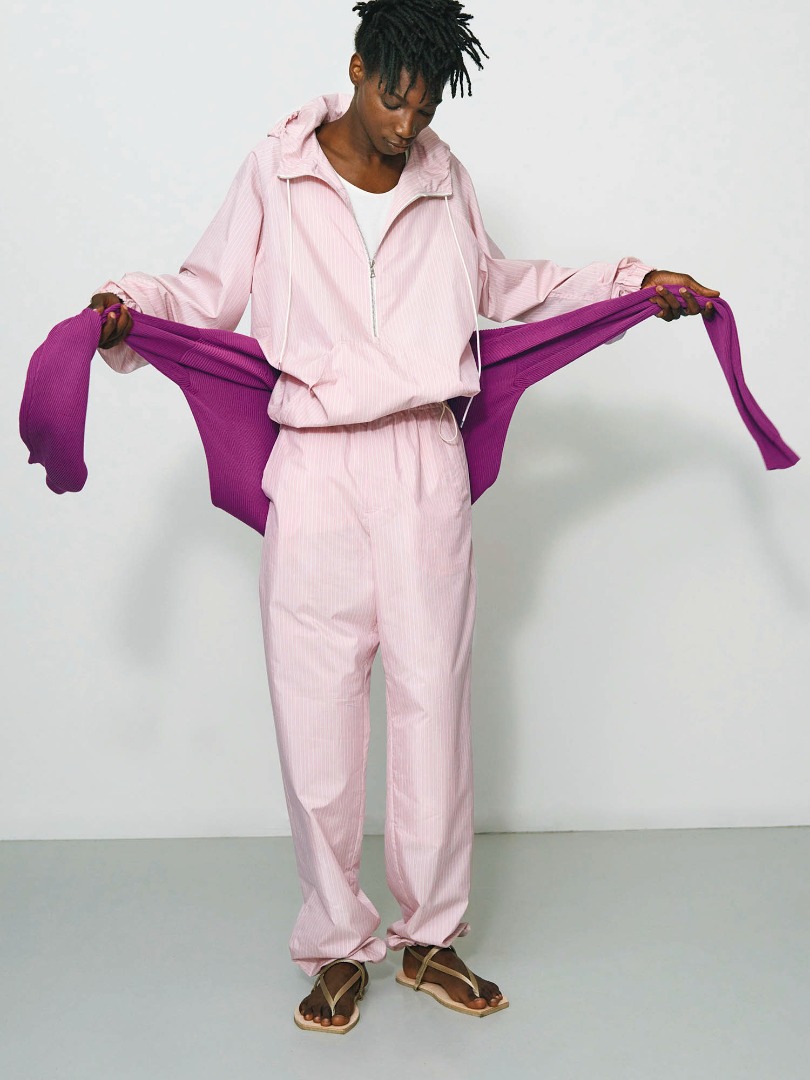 Sidy wears Finx Polyester Stripe Hooded Zip P/O in Pink Beige Stripe, Finx Polyester Stripe Shirt in Pink Beige Stripe, Super Hard Twist Rib Knit P/O in Purple